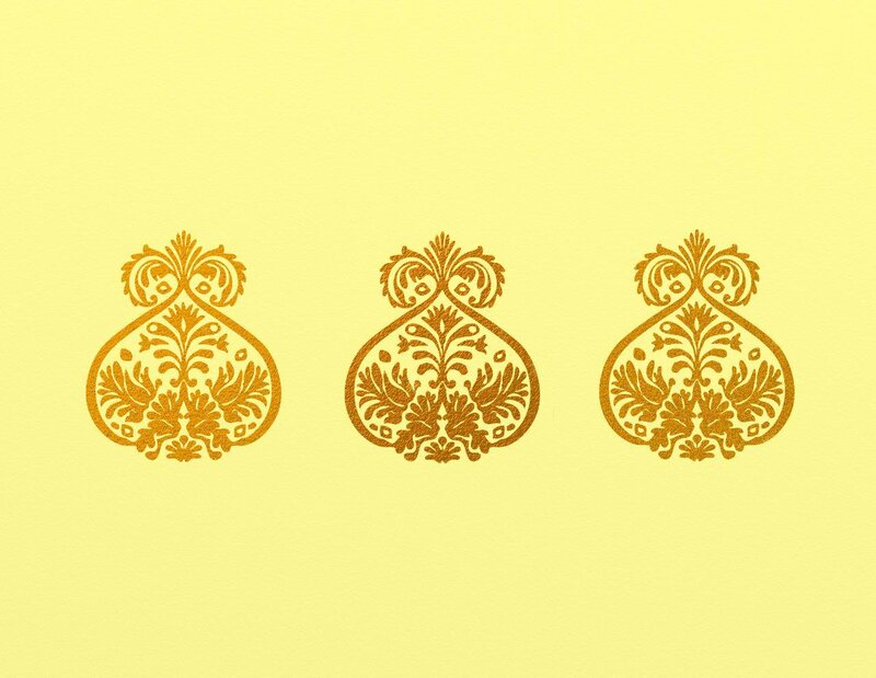 three golden ornate patterns
