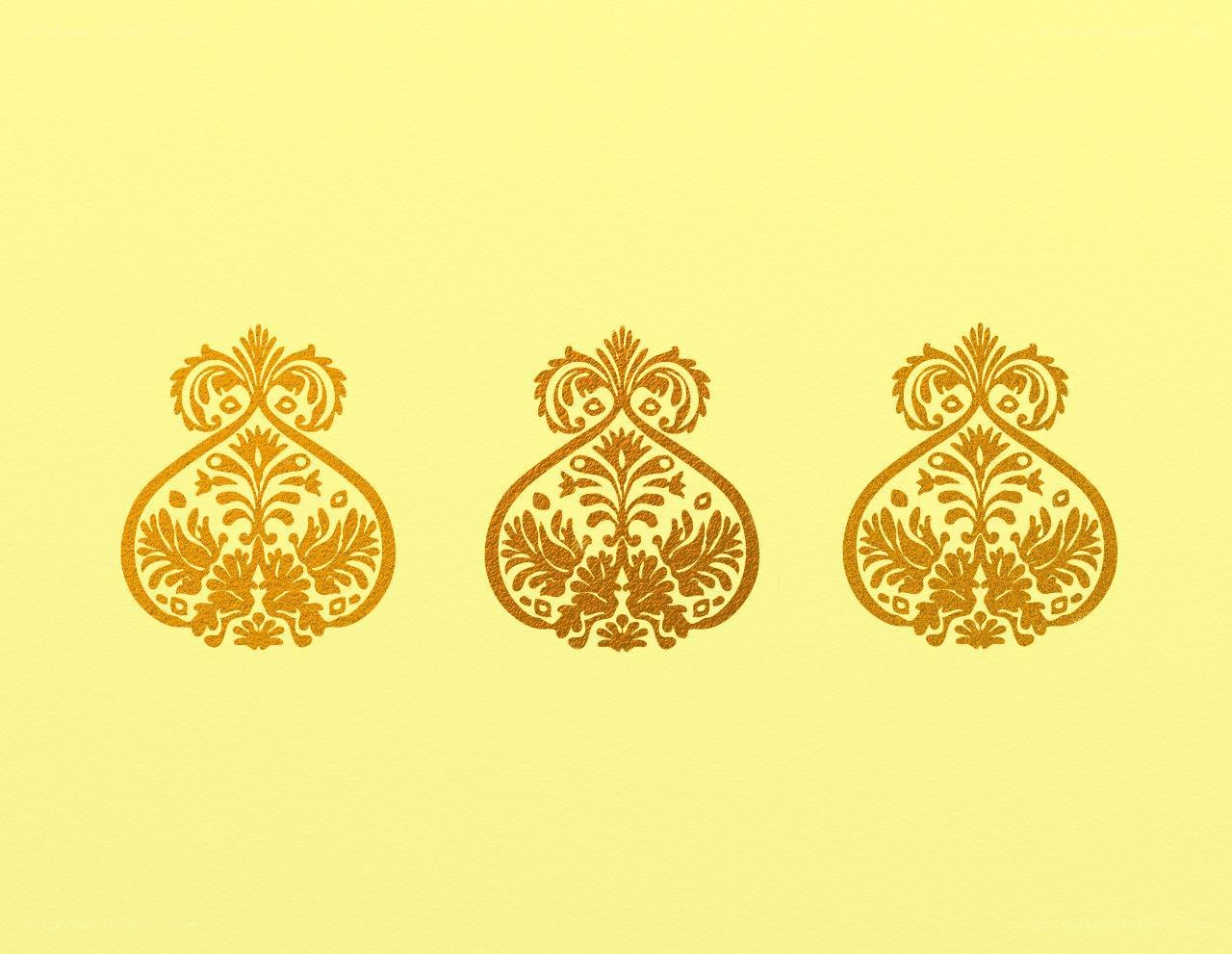 three golden ornate patterns