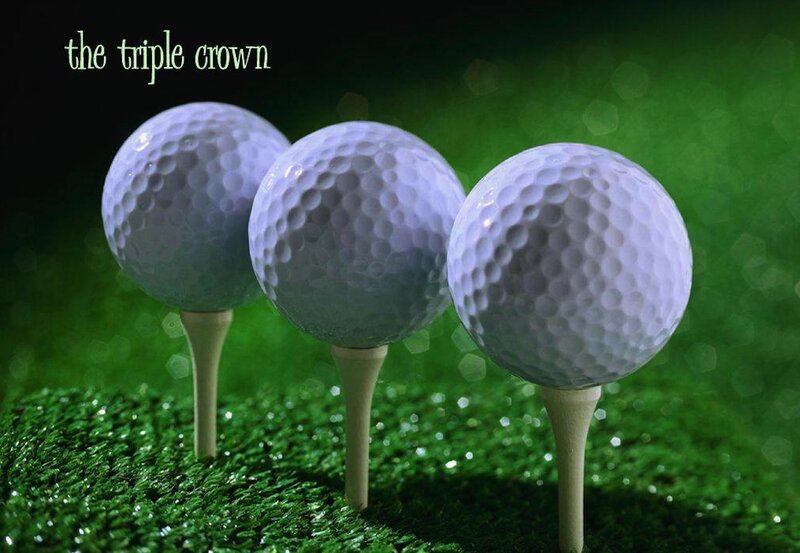 Three Golf Balls on Tees