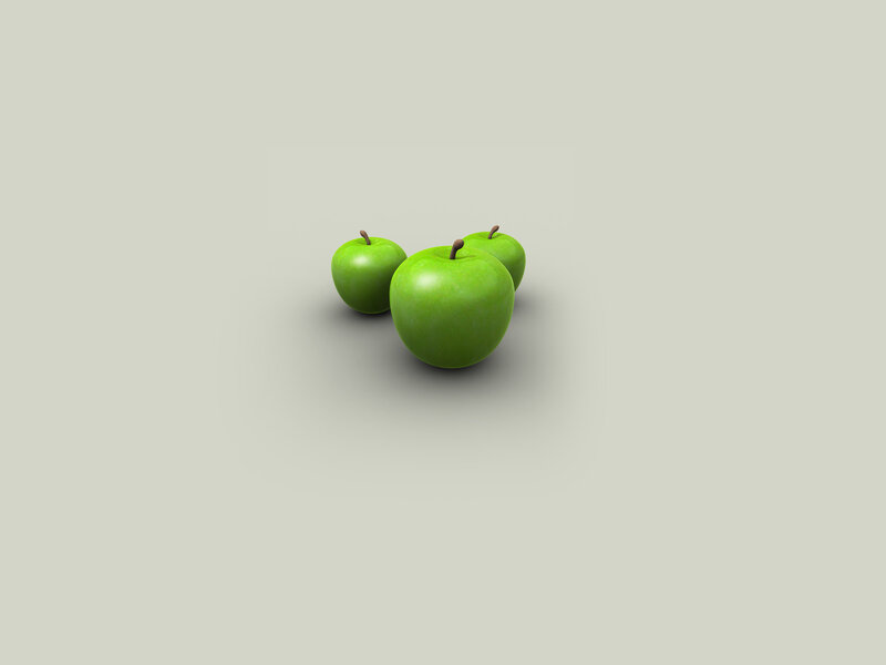 three green apples on gray