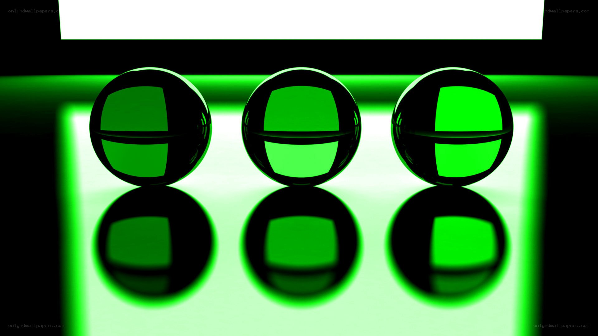 Three green spheres on reflective surface