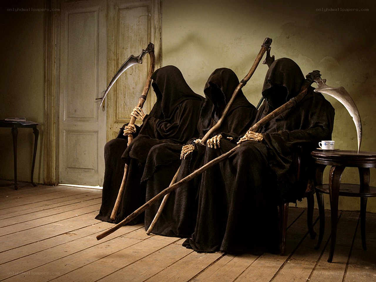 Three grim reapers sitting