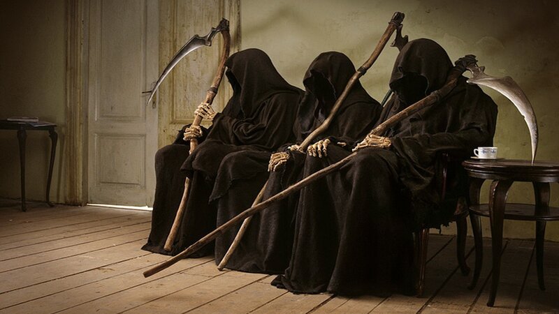 Three grim reapers sitting