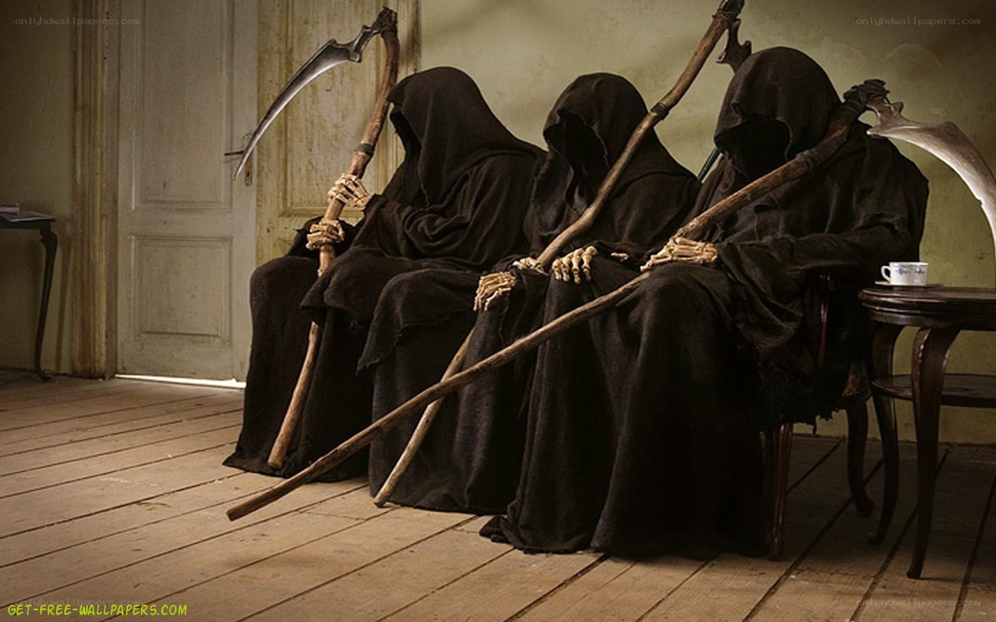 three grim reapers sitting
