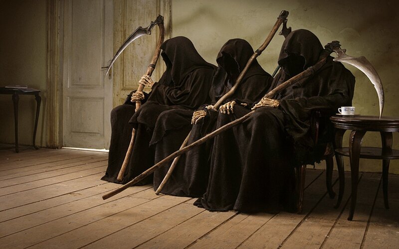 Three grim reapers sitting