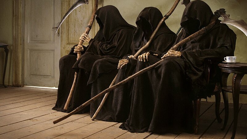 Three grim reapers sitting