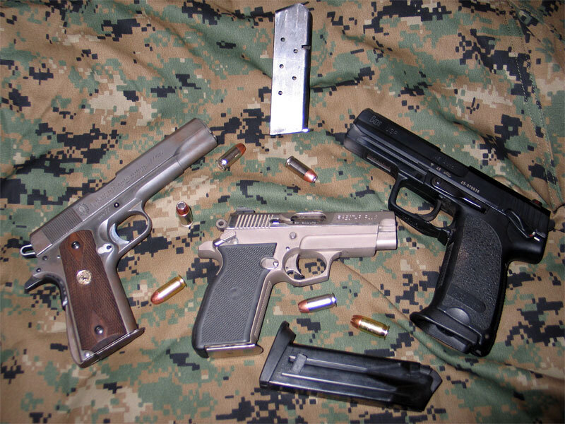 Three Handguns on Fabric