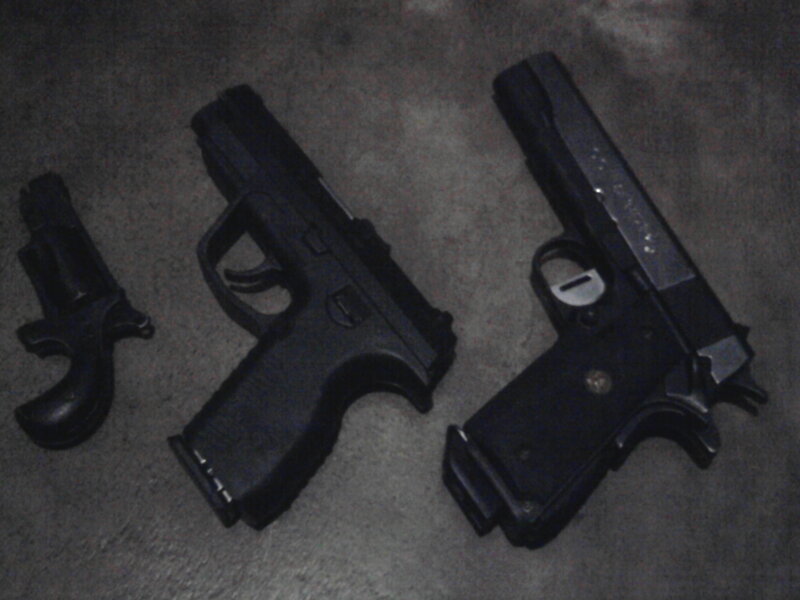 Three Handguns on Floor