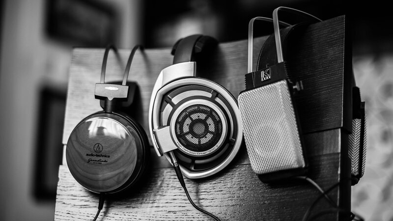 Three Headphones on Stand — Black, Neutral