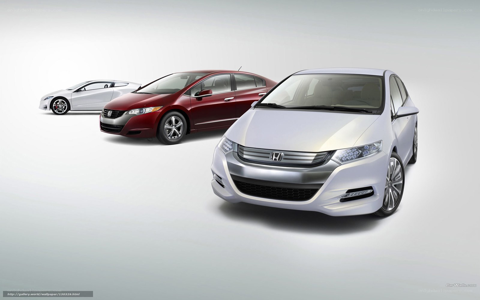 Three Honda Insight cars in a row