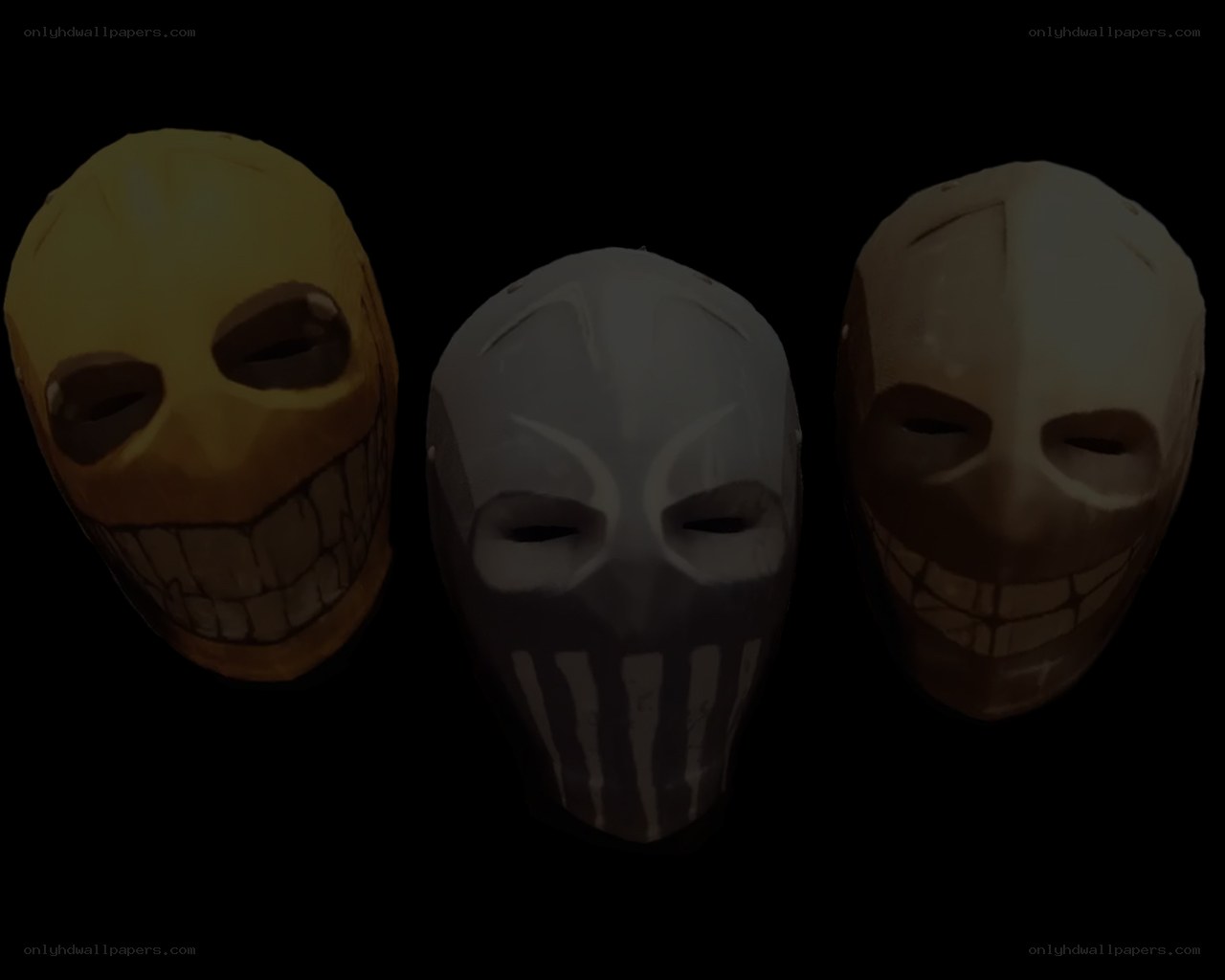three horror masks on black background