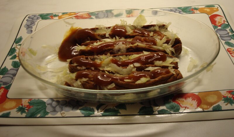 Three Hot Dogs in Bowl