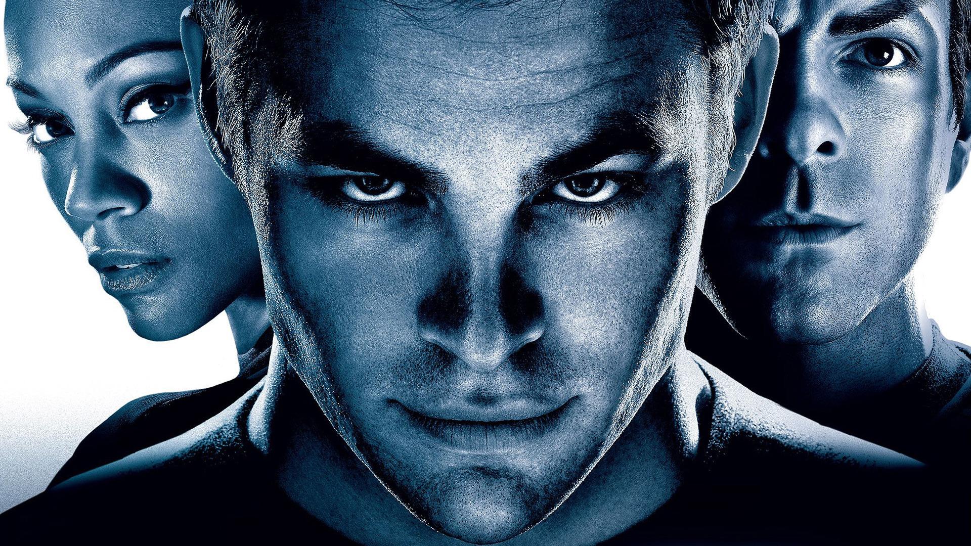 Three intense faces in blue light
