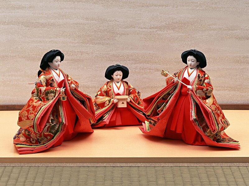 Three Japanese dolls in traditional attire