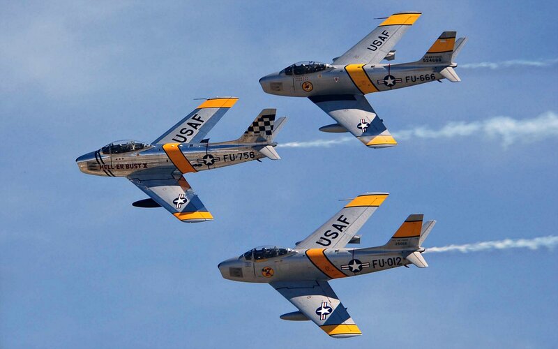 Three Jet Aircraft in Formation — Blue