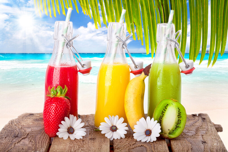 Three Juice Bottles on Beach
