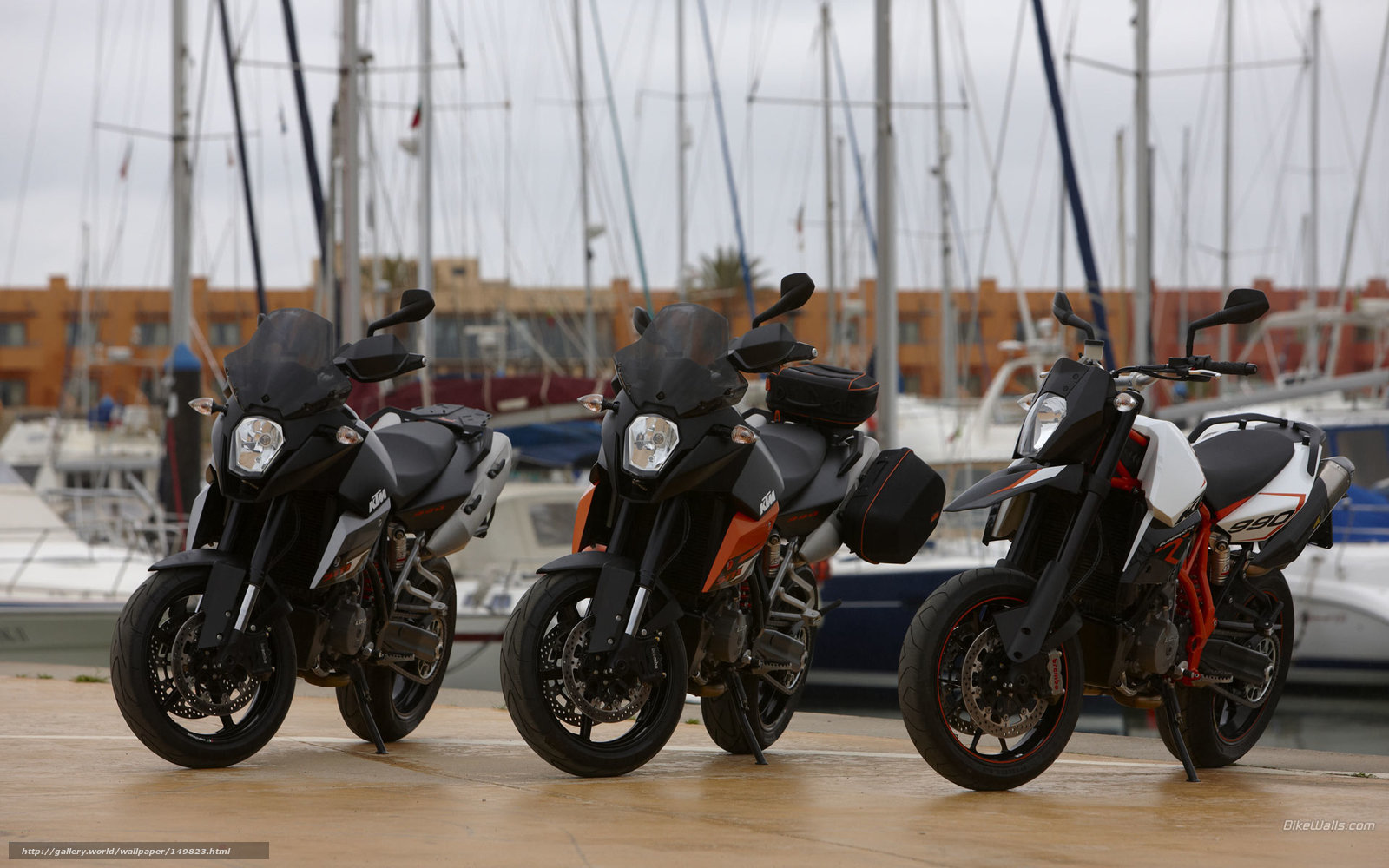 Three KTM motorcycles at marina