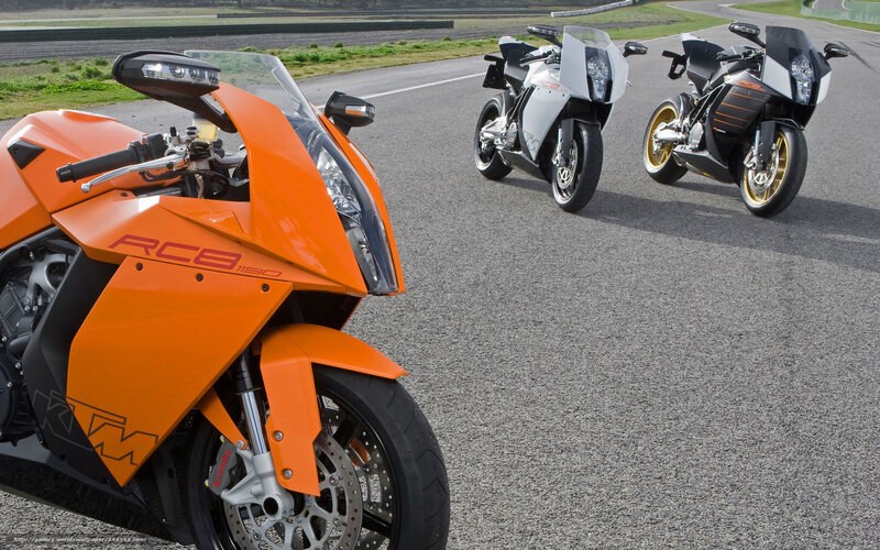 Three KTM RC8 motorcycles on track