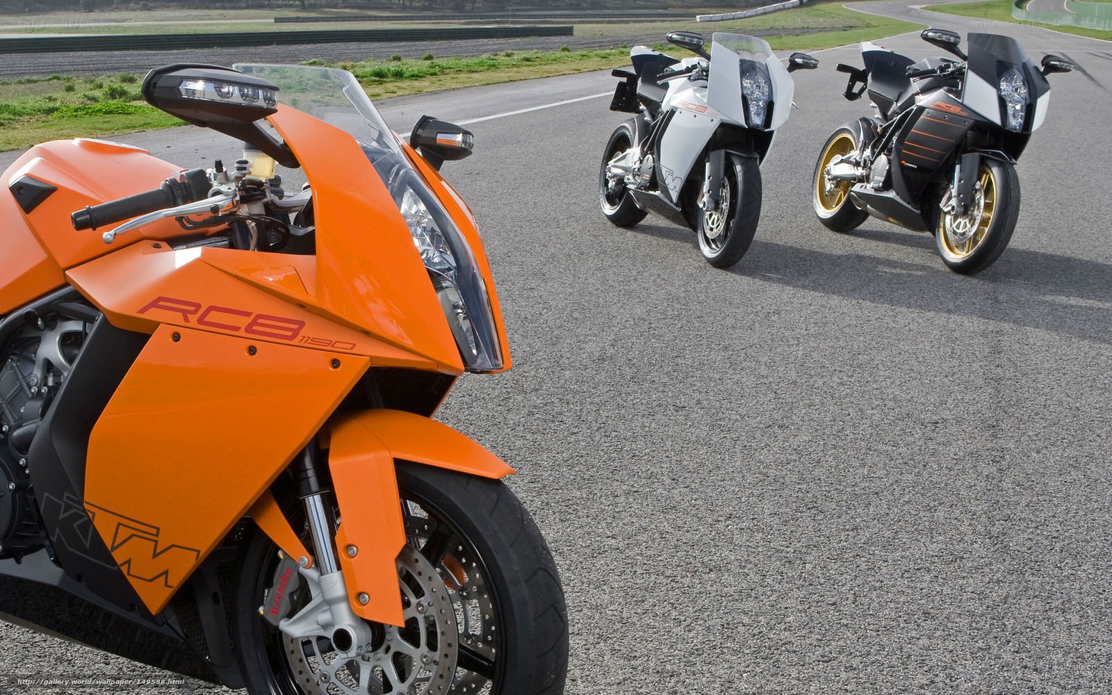 Three KTM RC8 motorcycles on track