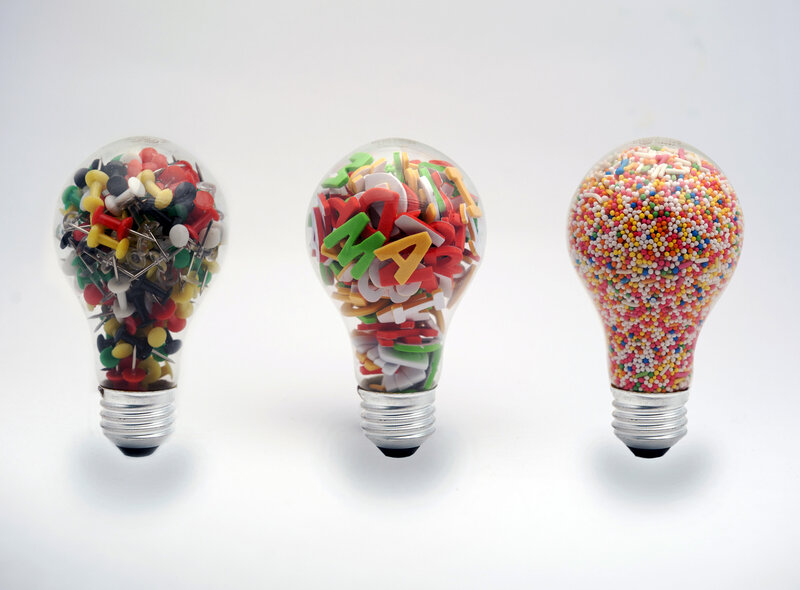 Three Light Bulbs Filled with Objects