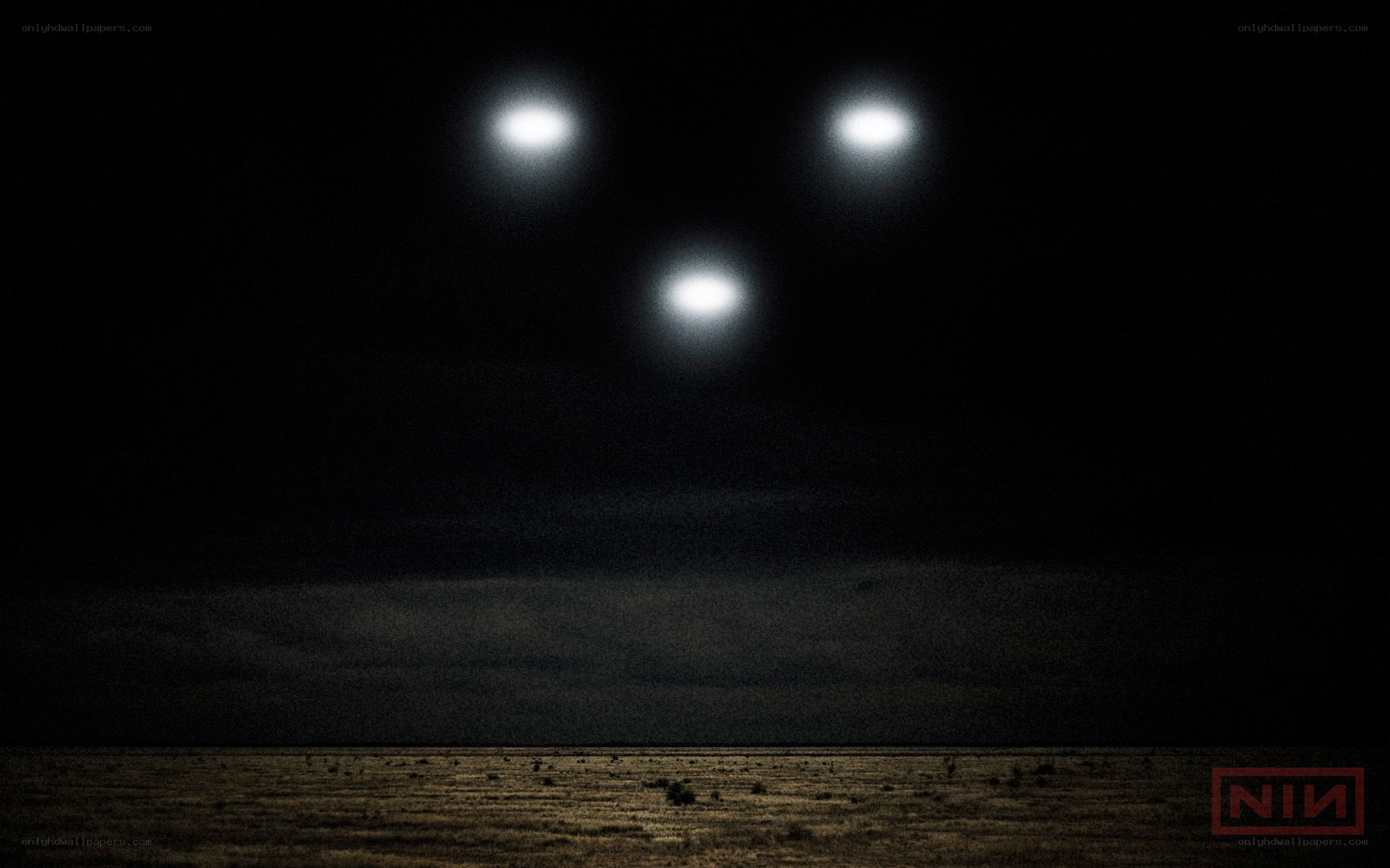 Three lights in night sky