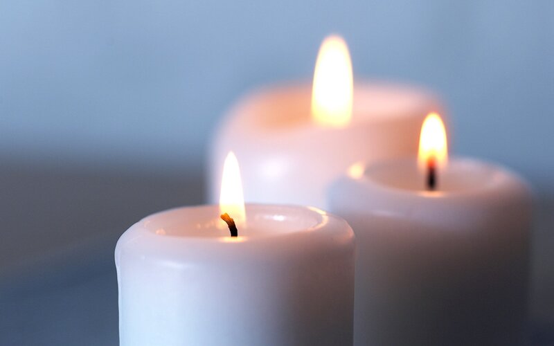 Three lit candles