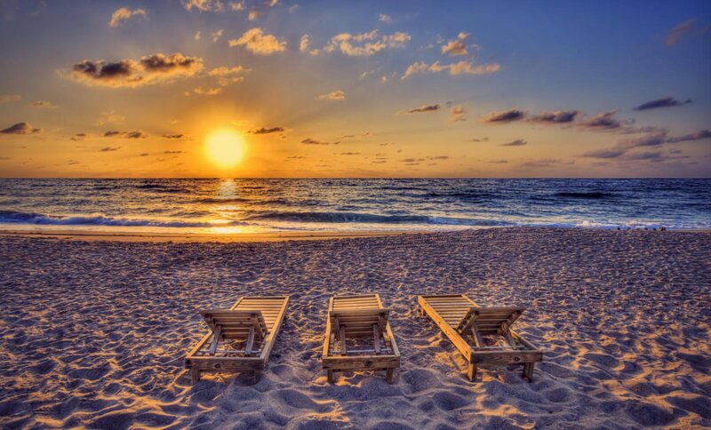 Three Lounge Chairs on Beach