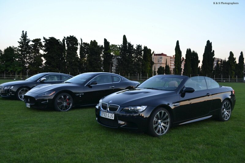Three Luxury Cars on Grass