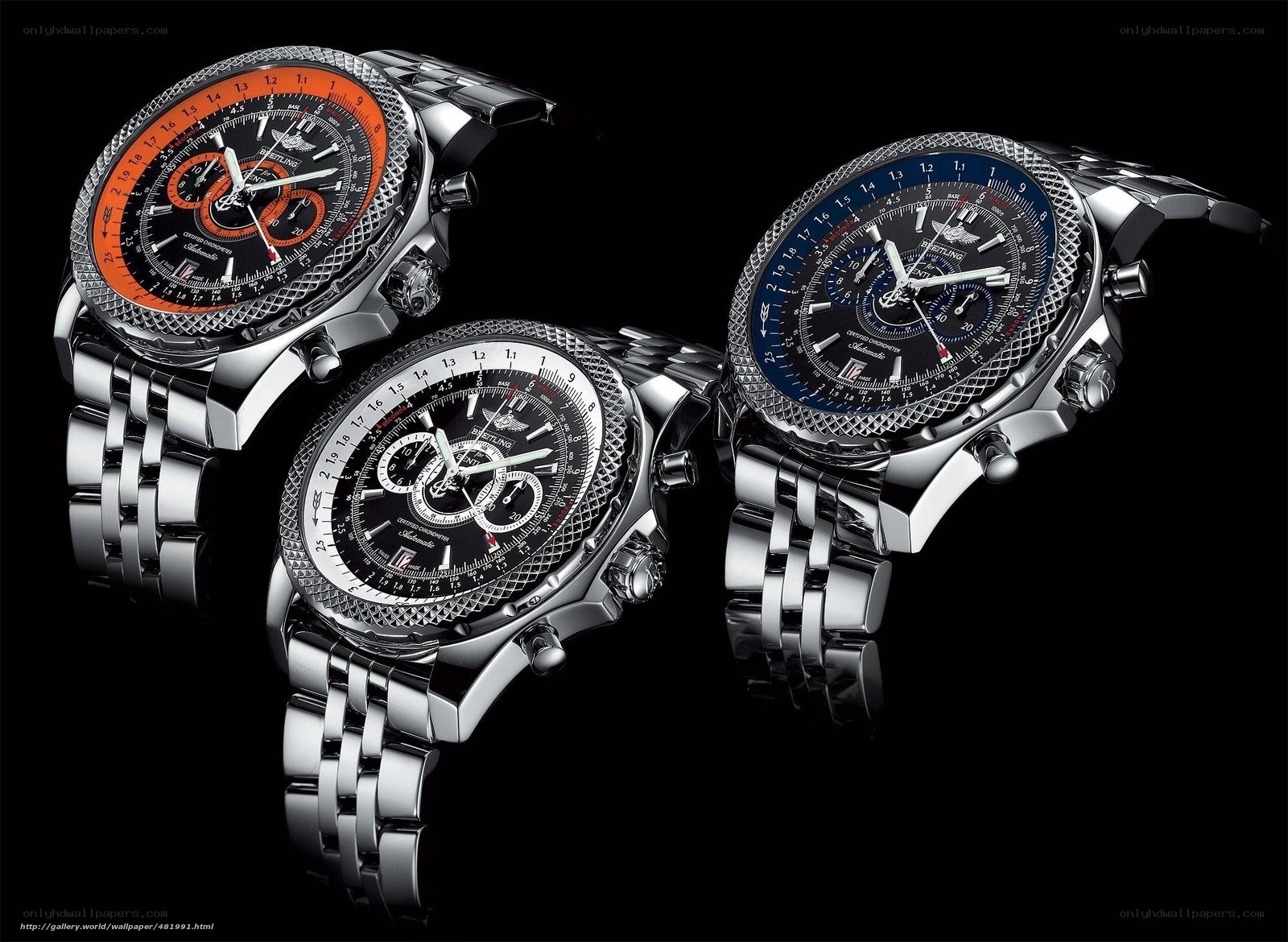 three luxury watches on black
