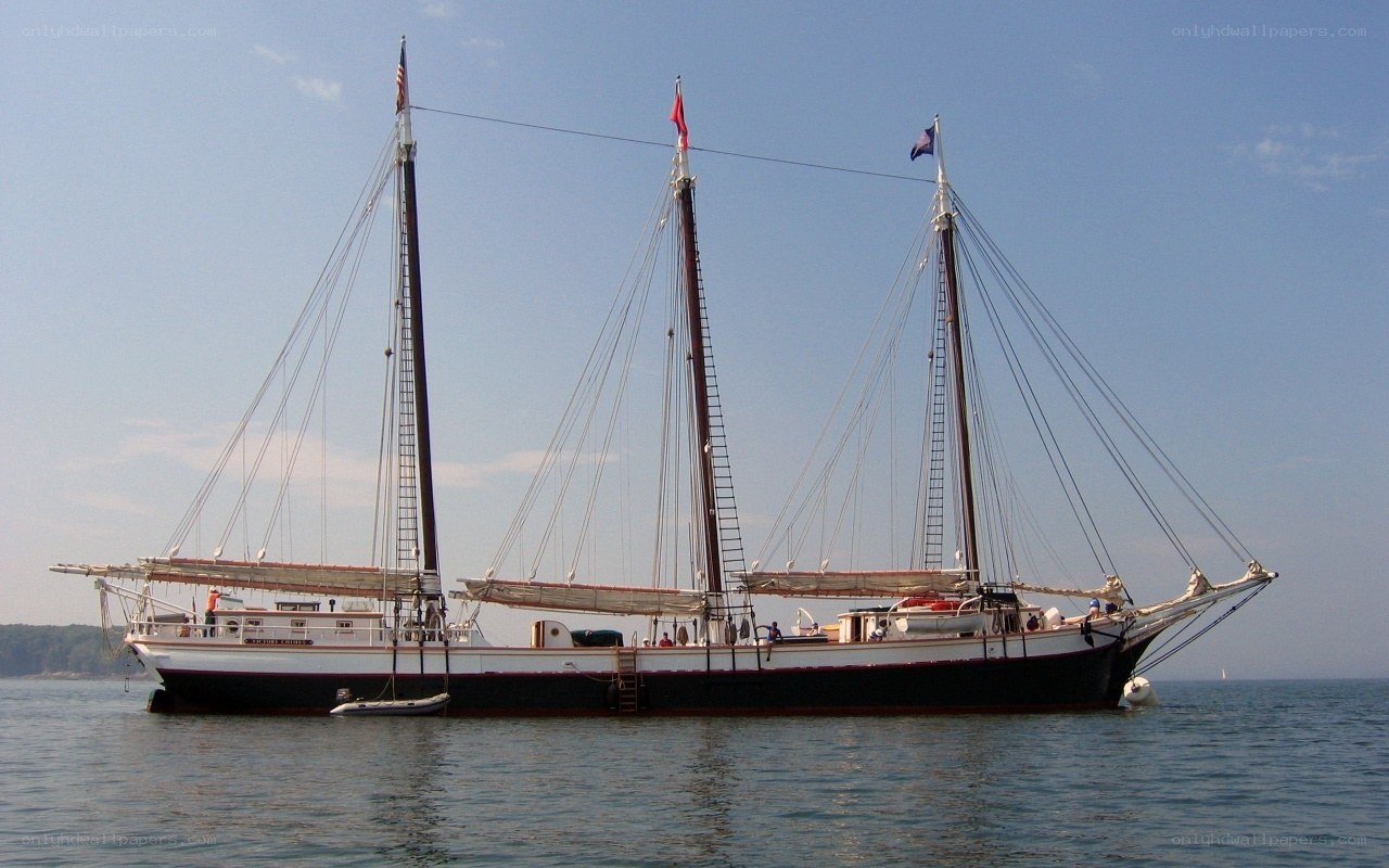 Three-masted schooner on calm water