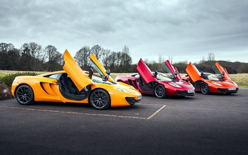 Three McLaren Sports Cars — Yellow, Dramatic, Photograph