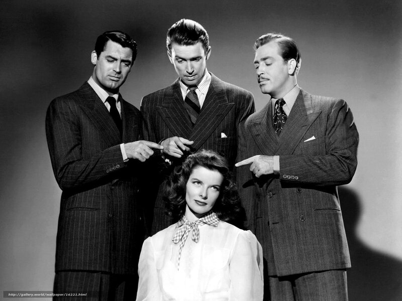 Three men and a woman in suits