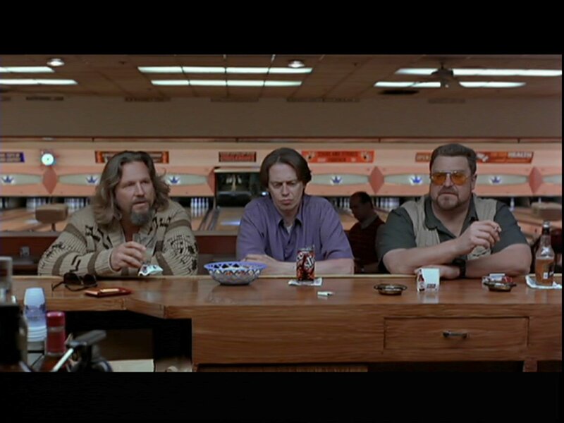 Three men at a bowling alley