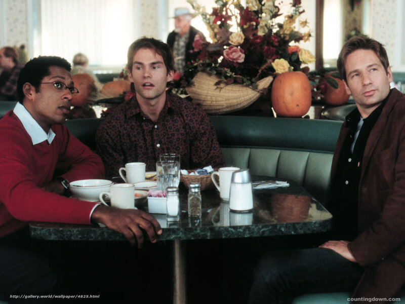 Three men at a diner table