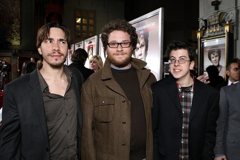 Three men at a movie premiere