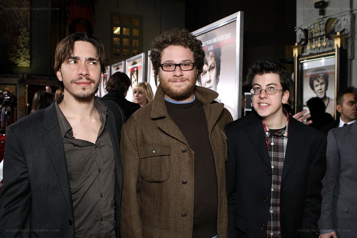 Three men at a movie premiere