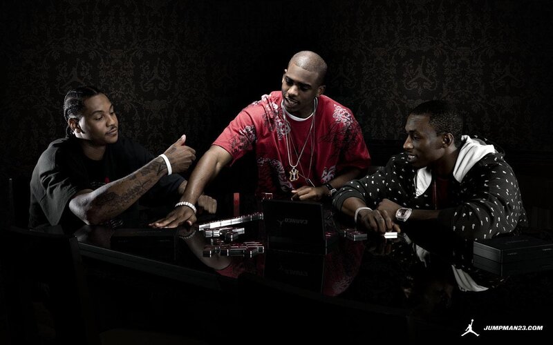 Three men at a table with dominoes
