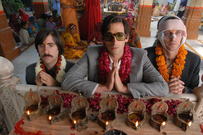 Three men at a temple ceremony