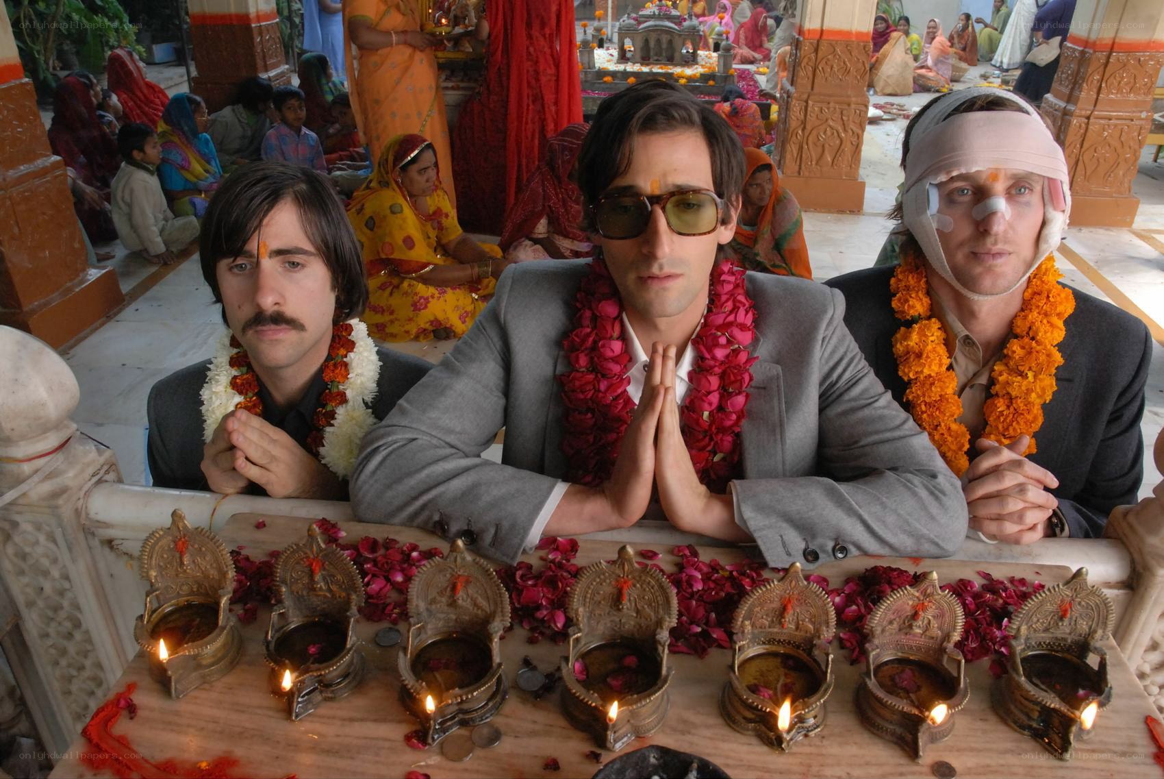 Three men at a temple ceremony