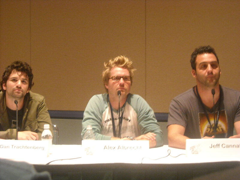 three men at panel discussion