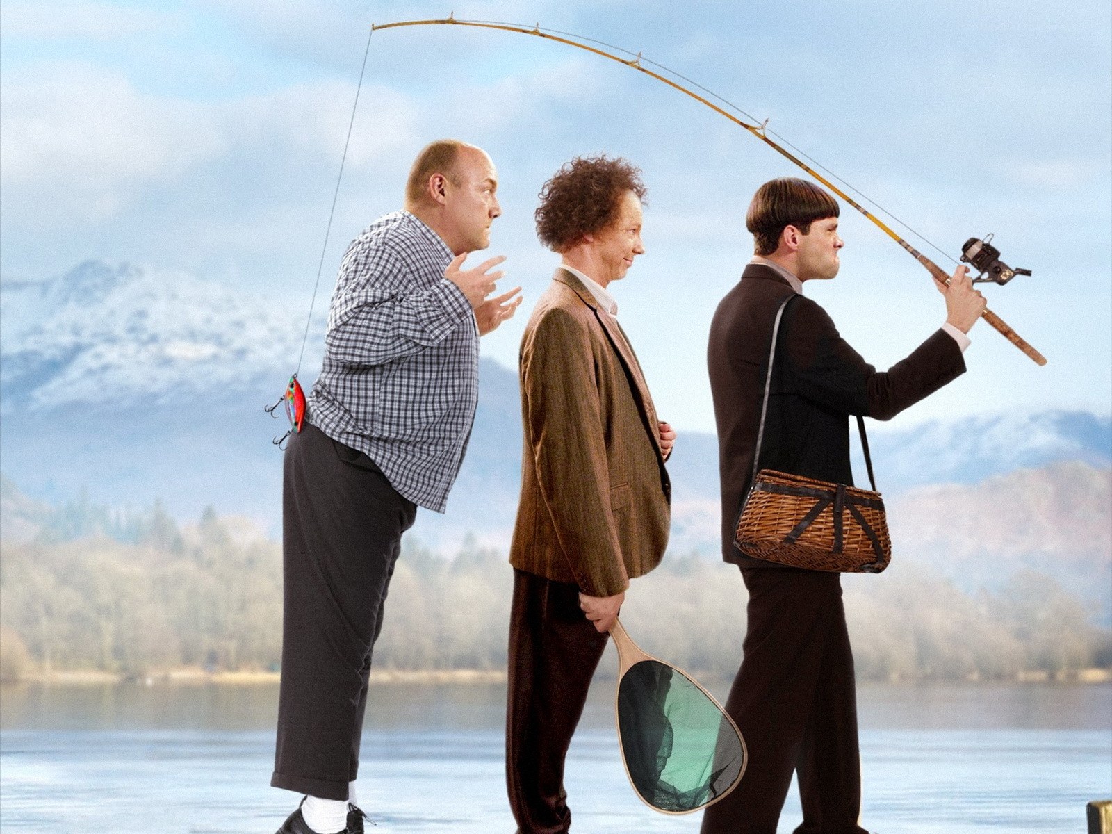Three men fishing by a lake