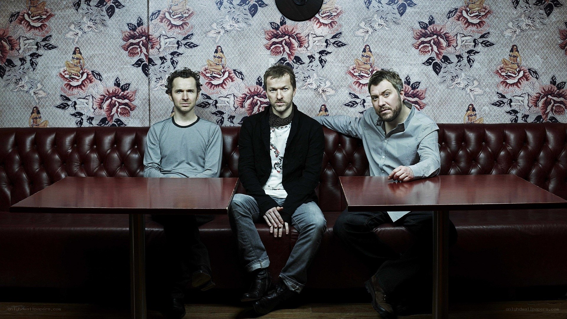three men in a booth