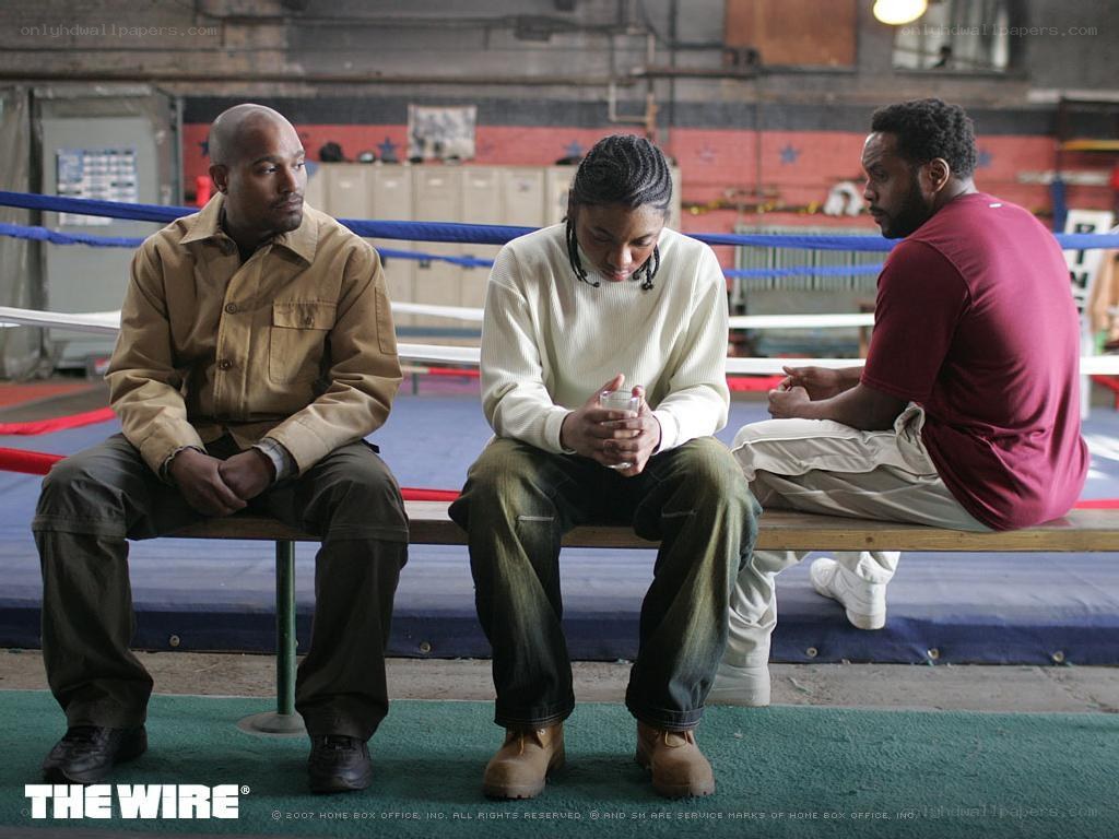 Three men in a boxing ring