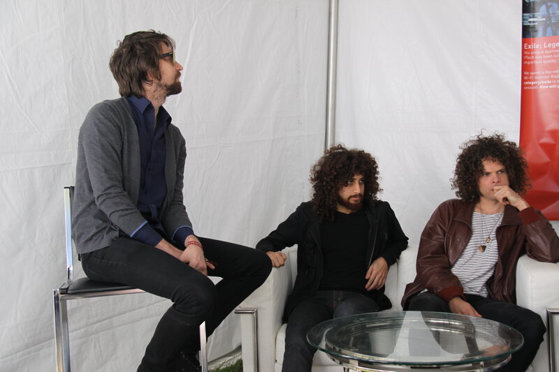 three men in a discussion