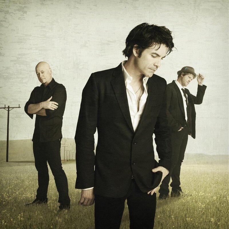 three men in a field