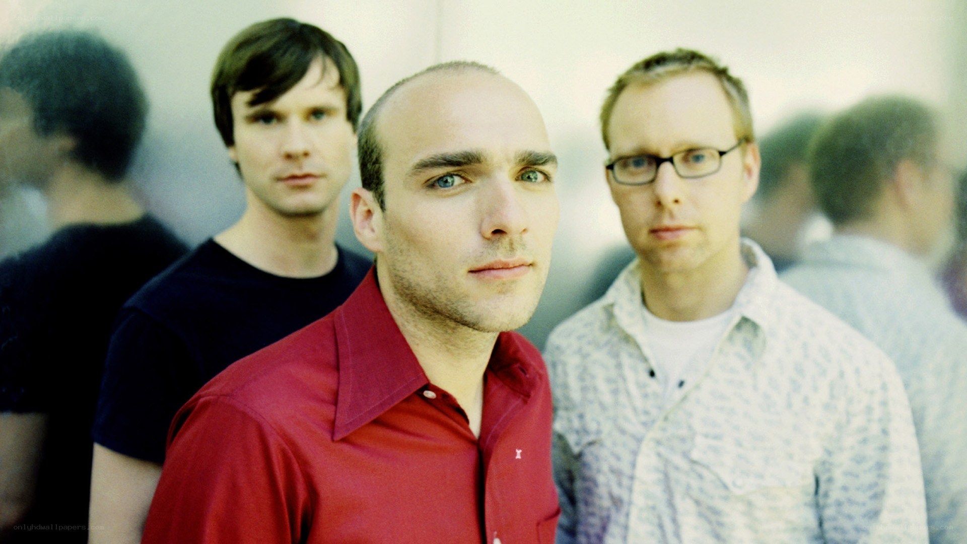 three men in a group photo