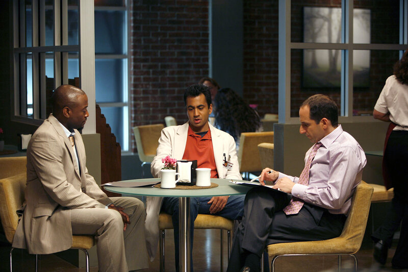 Three men in a meeting