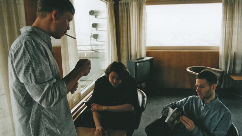 Three Men in a Room — Gray, Calm