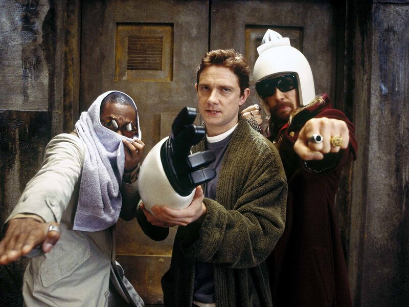 Three men in a sci-fi scene