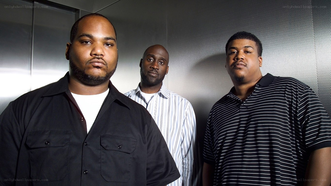 three men in a studio portrait
